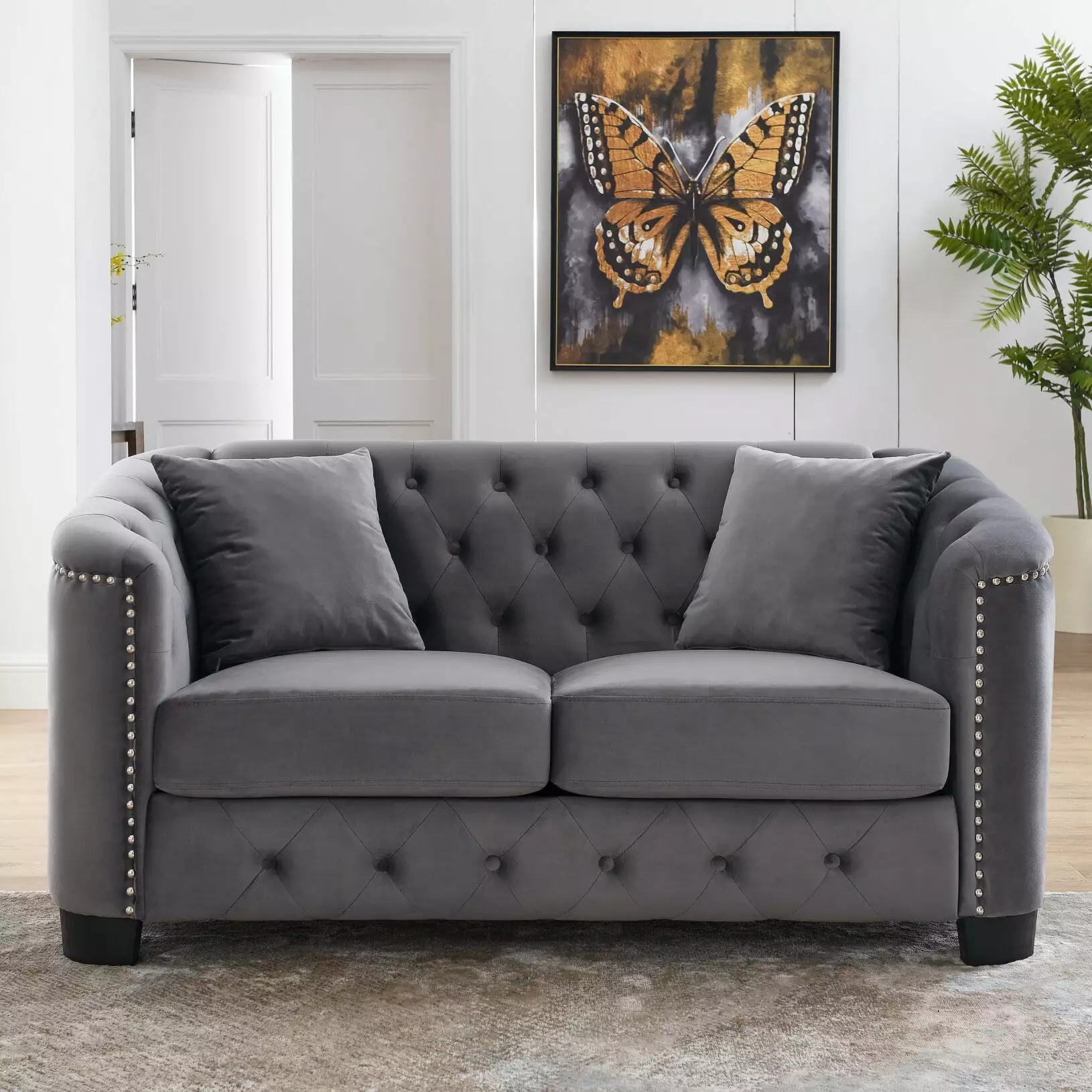 Modern Chesterfield Velvet 2-Seater Sofa with 2 Cushions. Upholstered Tufted Backrests with Nailhead Arms and Black Feet. Sofa Couch for Living Room. Grey